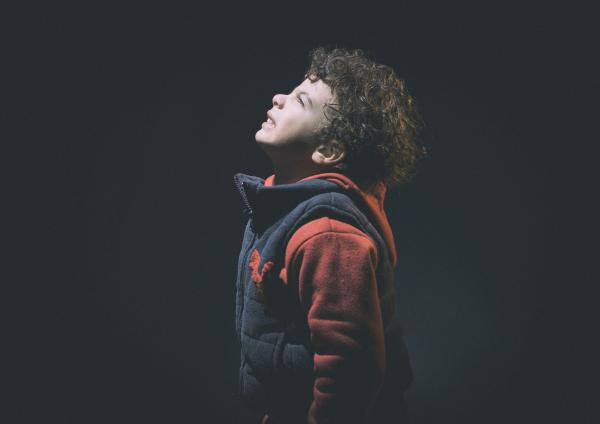Little Boy Wearing Black And Red Jacket