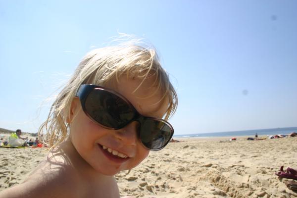 Little Girl with too big sunglasses on t