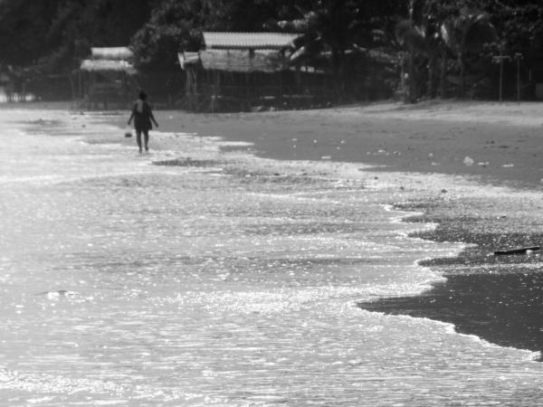 Lonely Worker on the Beach