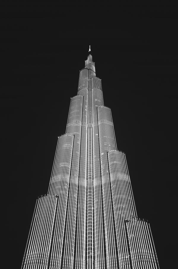 Low Angle View of Skyscraper Against Sky at Night