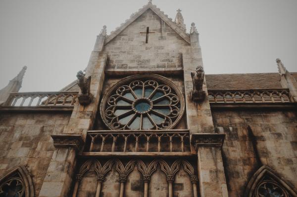 Low-angle Photo of Brown Concrete Cathedral