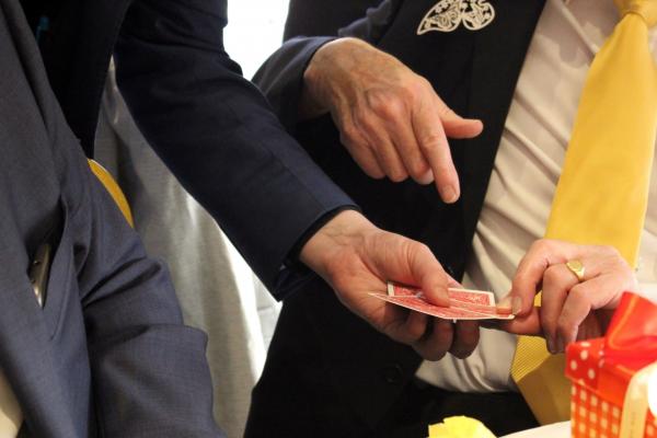 Magician gets a man to pick a card