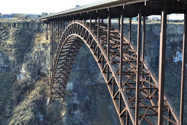 Majestic metal bridge over a huge abyss