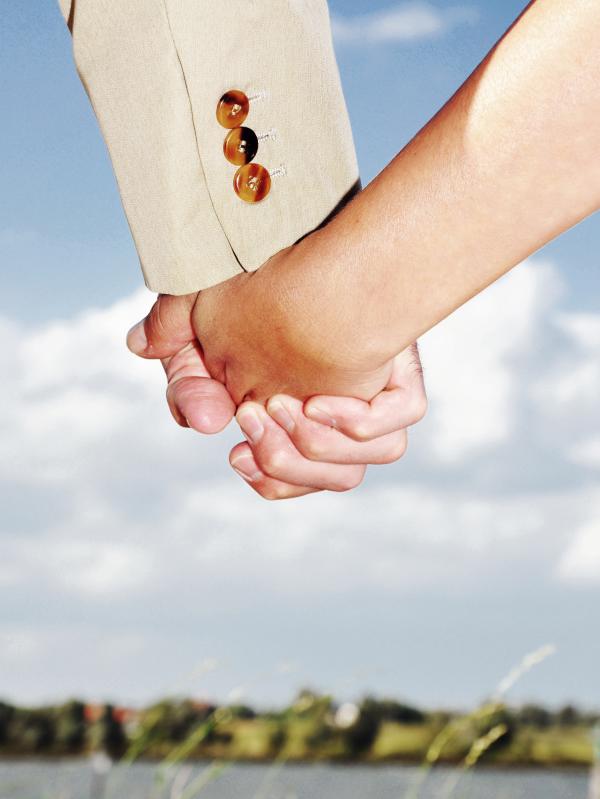 Man and woman holding hands