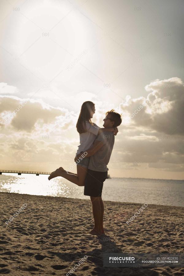 Man Carrying Woman