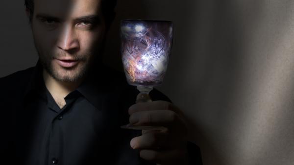 man holding wine glass