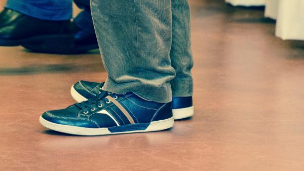 Man in Black Pants and Black Brown and White Low Tops