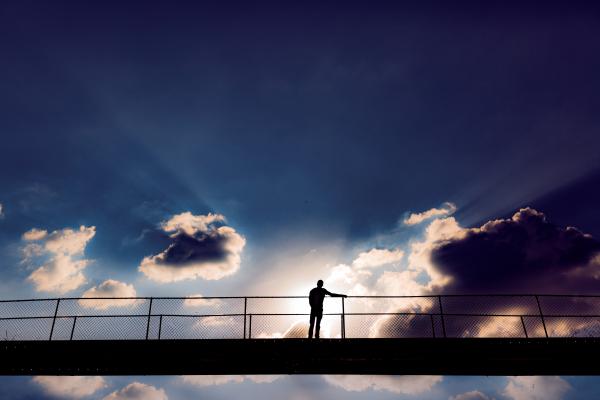 Man In The Middle Of A Bridge