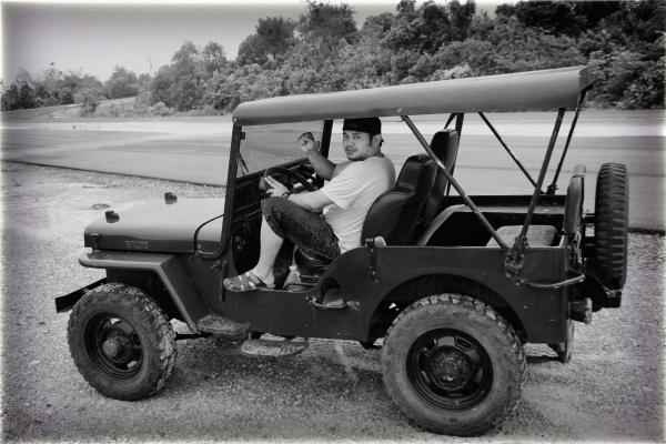 Man in Willy's Jeep