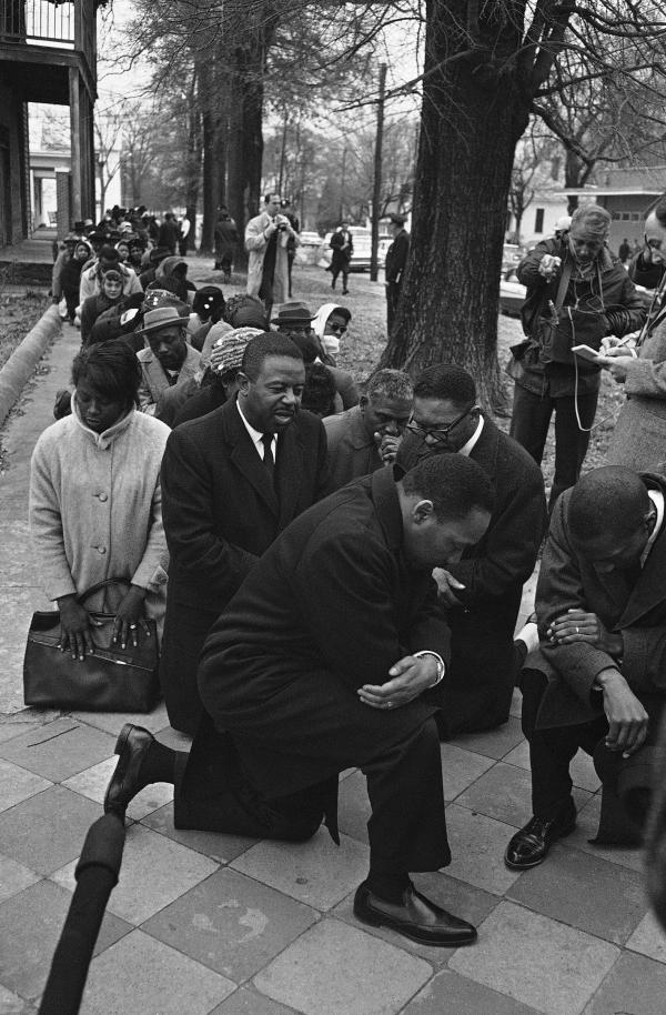 Man Kneeling in Front of Woman