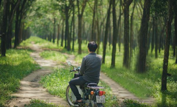 Man Riding A Moped