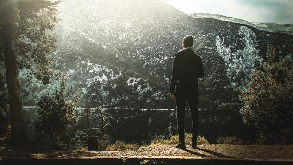 Man Standing On Cliff