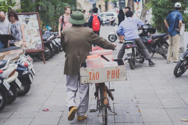 Man Walking With Bike