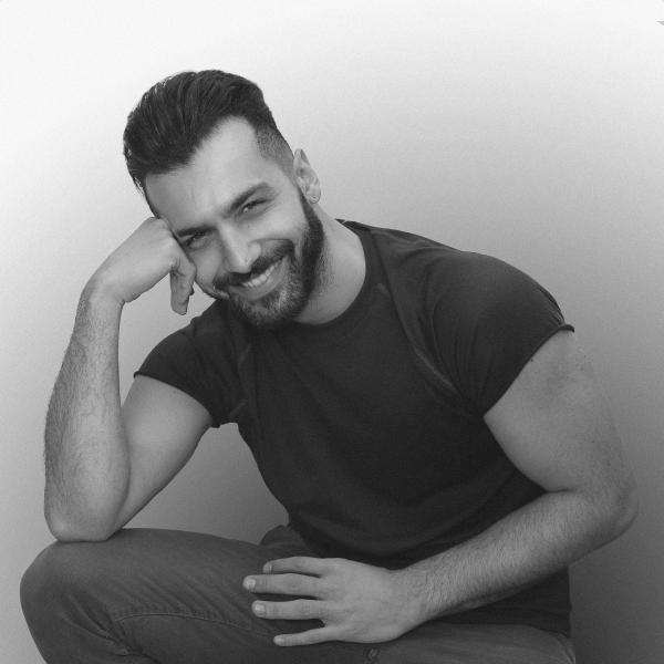 Man Wearing Black Crew-neck Shirt and Straight-cut Jeans