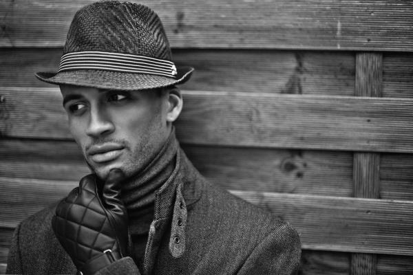 Man Wearing Black Hat and Gloves
