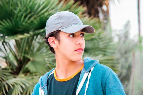 Man Wearing Gray Cap and Blue Jacket