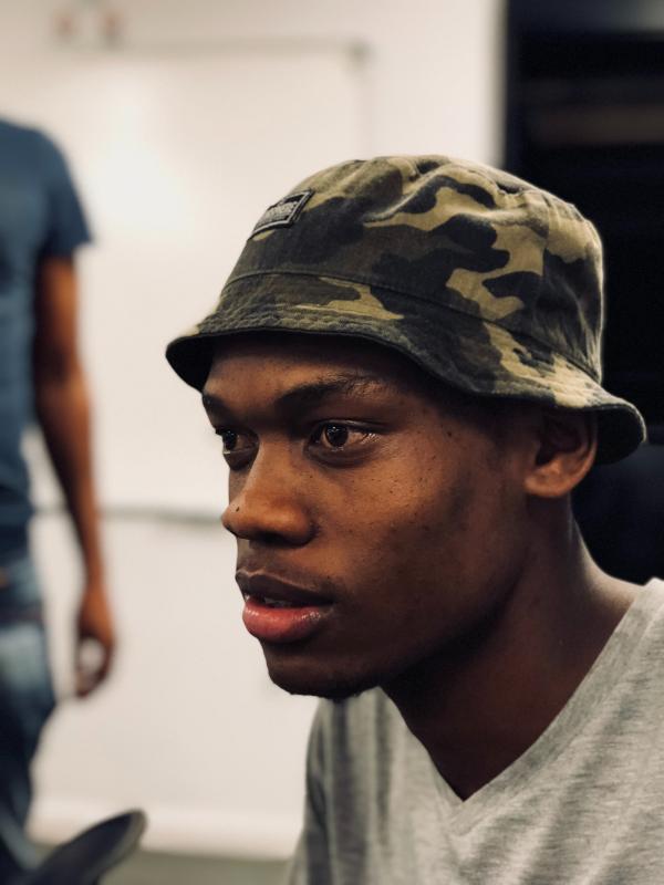 Man Wearing Woodland Camouflage Bucket Hat