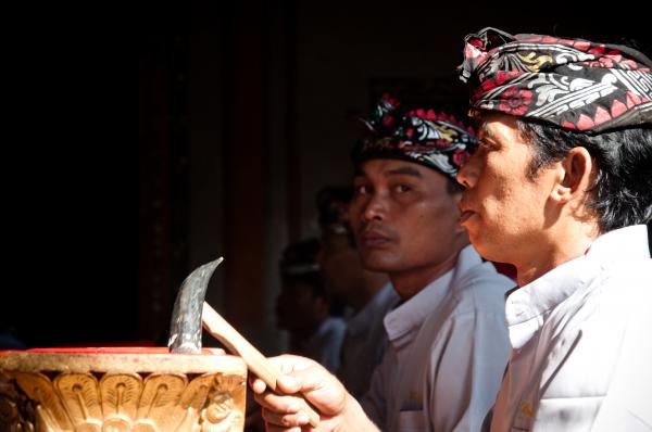 Men play traditional gamelan percussion