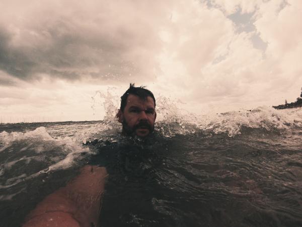 Men's on the Sea While Under the White Clouds