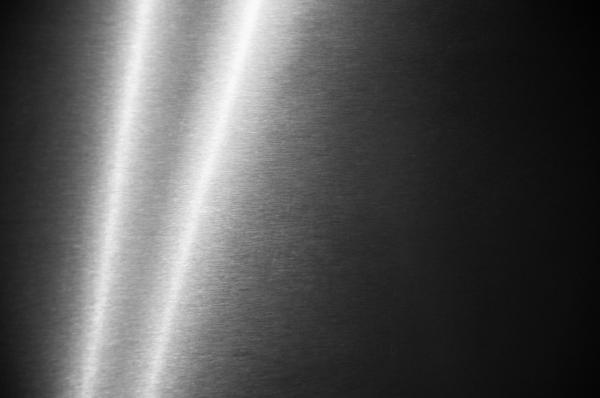 Metal background with light streak