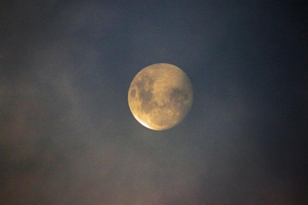 Moon lighting in the clouds
