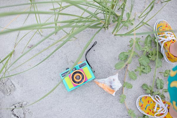 Multicolored Digital Camera With Pair Brown Shoes