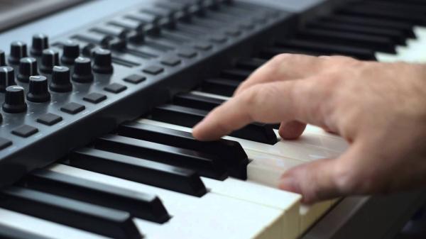 musician on keyboard