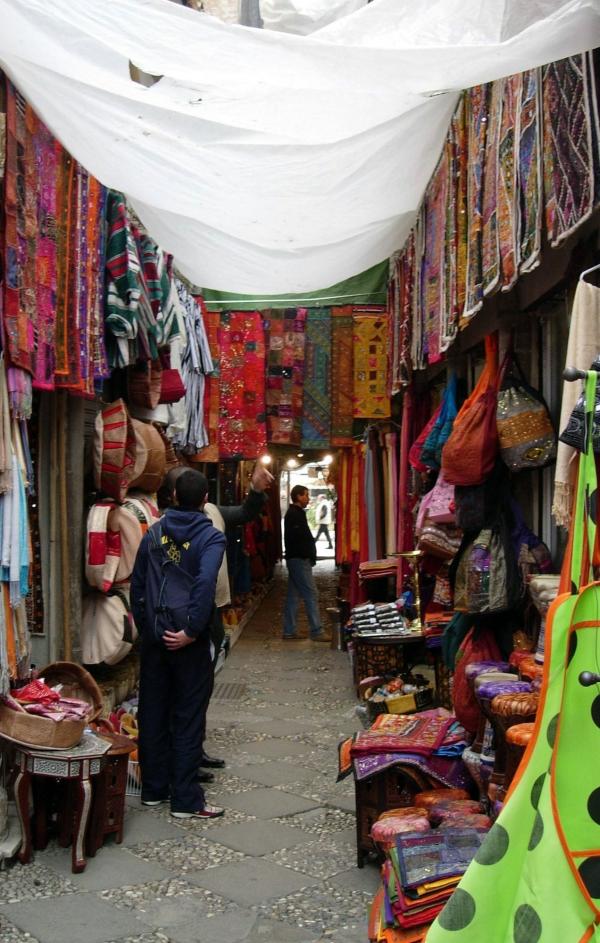 Narrow market street with shops