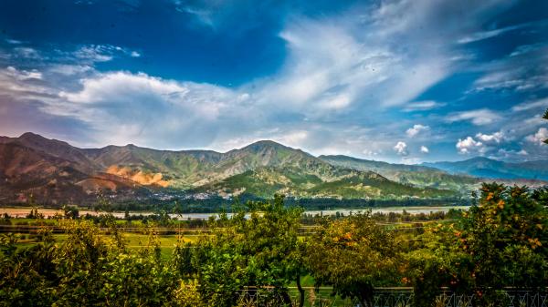 Nature Photography of Mountains and Trees Under Cloudy Sky during Daytime
