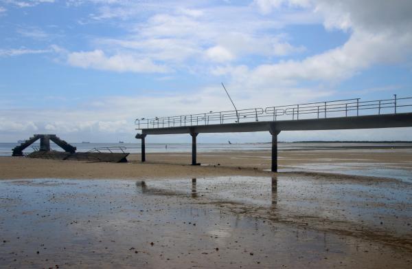 Old beach pier on the beach
