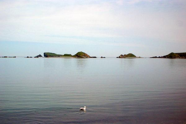 Open water with some rocks in the distan