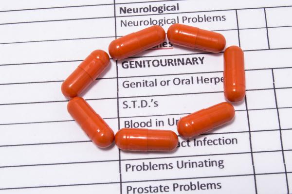 Orange antibiotic capsules around the inscription