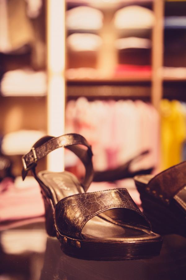 Pair of Brown Leather Sandals on Wooden Slab