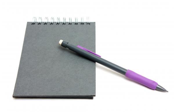 Paper and a pencil isolated