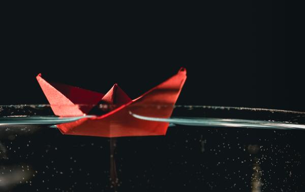 Paper boat on water