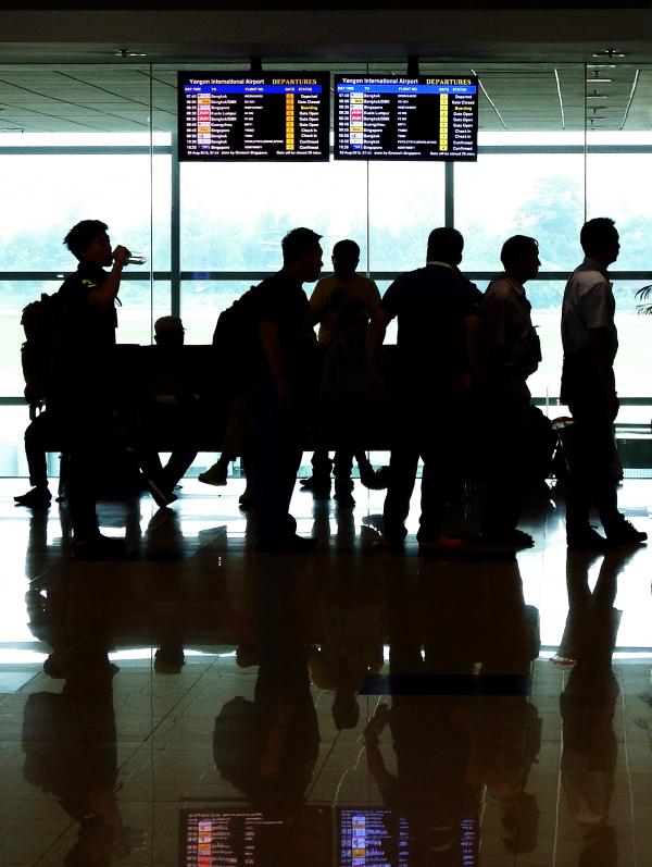 Passenger Silhouettes at Airport