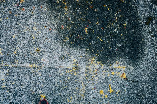 Peeled Yellow Paint on Concrete