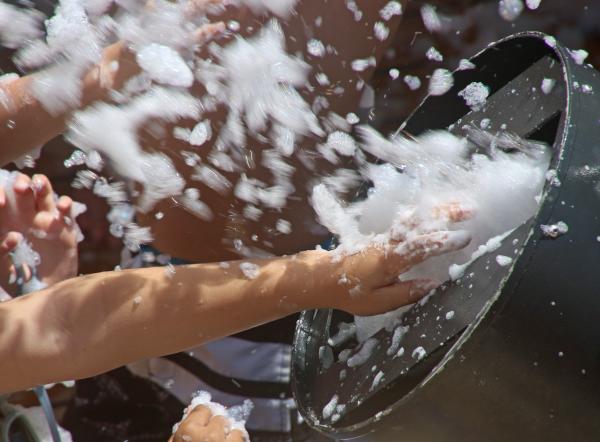 People playing with soap bubbles