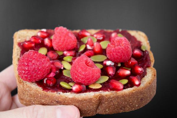 Person Holding Brown Bread With Strawberries