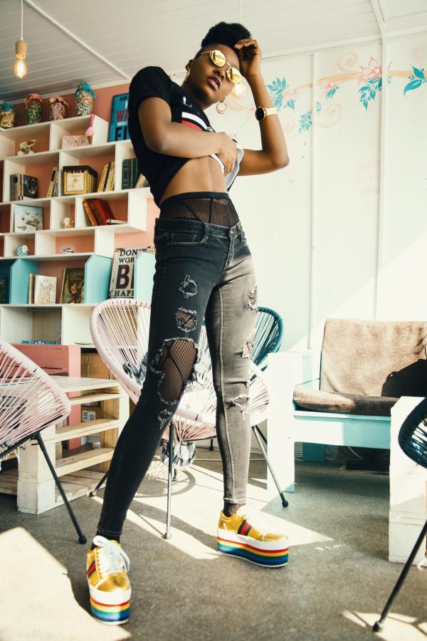 Person in Black Distressed Jeans