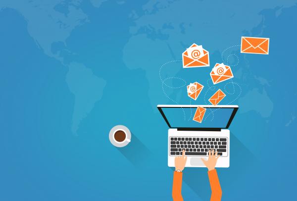 Person on Laptop Sending Virtual Envelopes