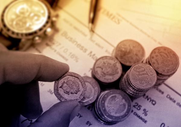 Person Picking a Coin - Money and Finance Concept