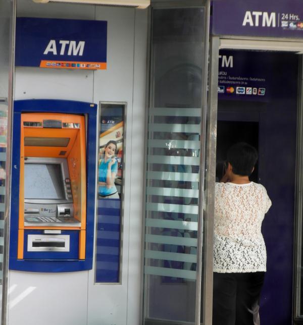 Person Using an ATM Machine