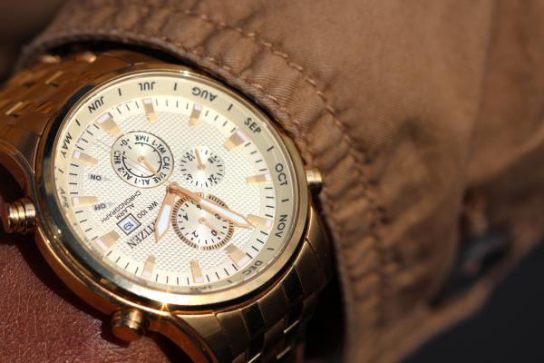 Person Wearing Silver Linked Chronograph Watch