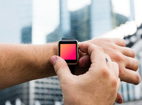 Person Wearing Watch and Adjusting Watch
