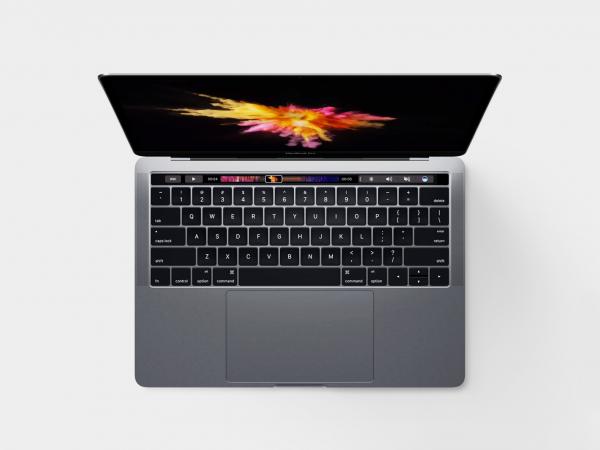 Person With Grey Ring Using Macbook Pro