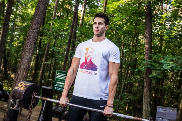 Photo of Man Holding Barbell