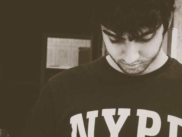 Photo Of Man Wearing NYPD Crew-neck Shirt