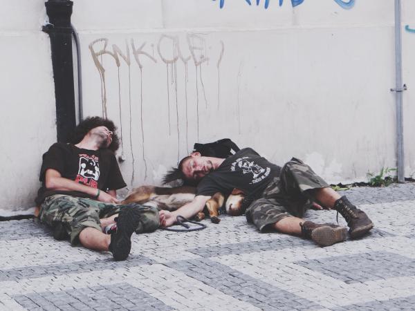 Photo of Men Sleeping on the Street