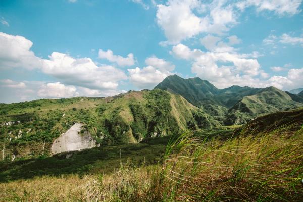 Photo of Mountains Covered with Grass